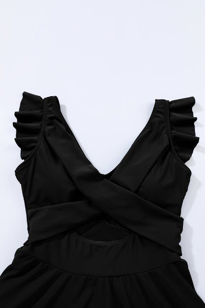 Chic black two-tone cutout swimdress with criss-cross design