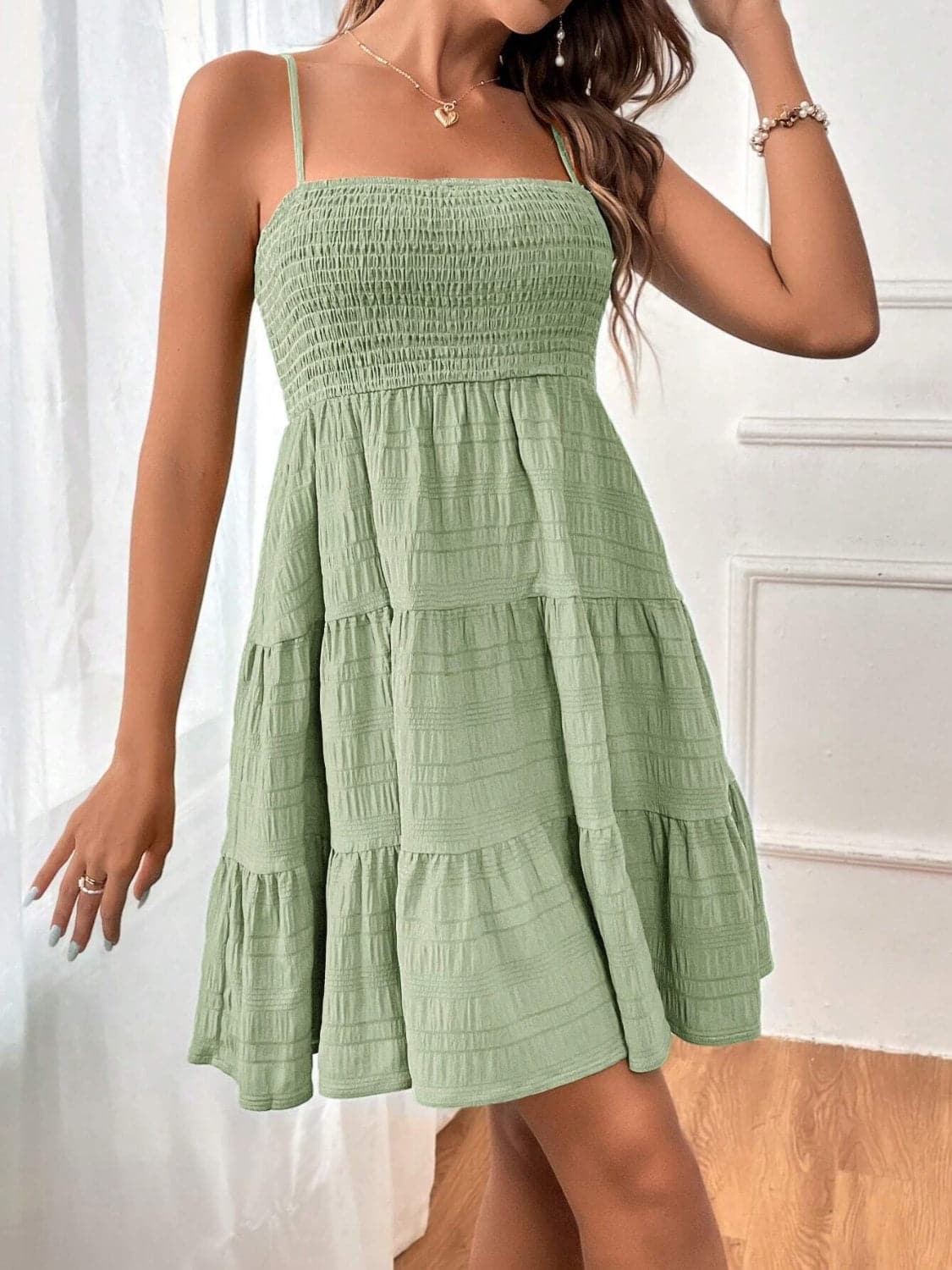 Smocked Tiered Sleeveless Mini Dress.