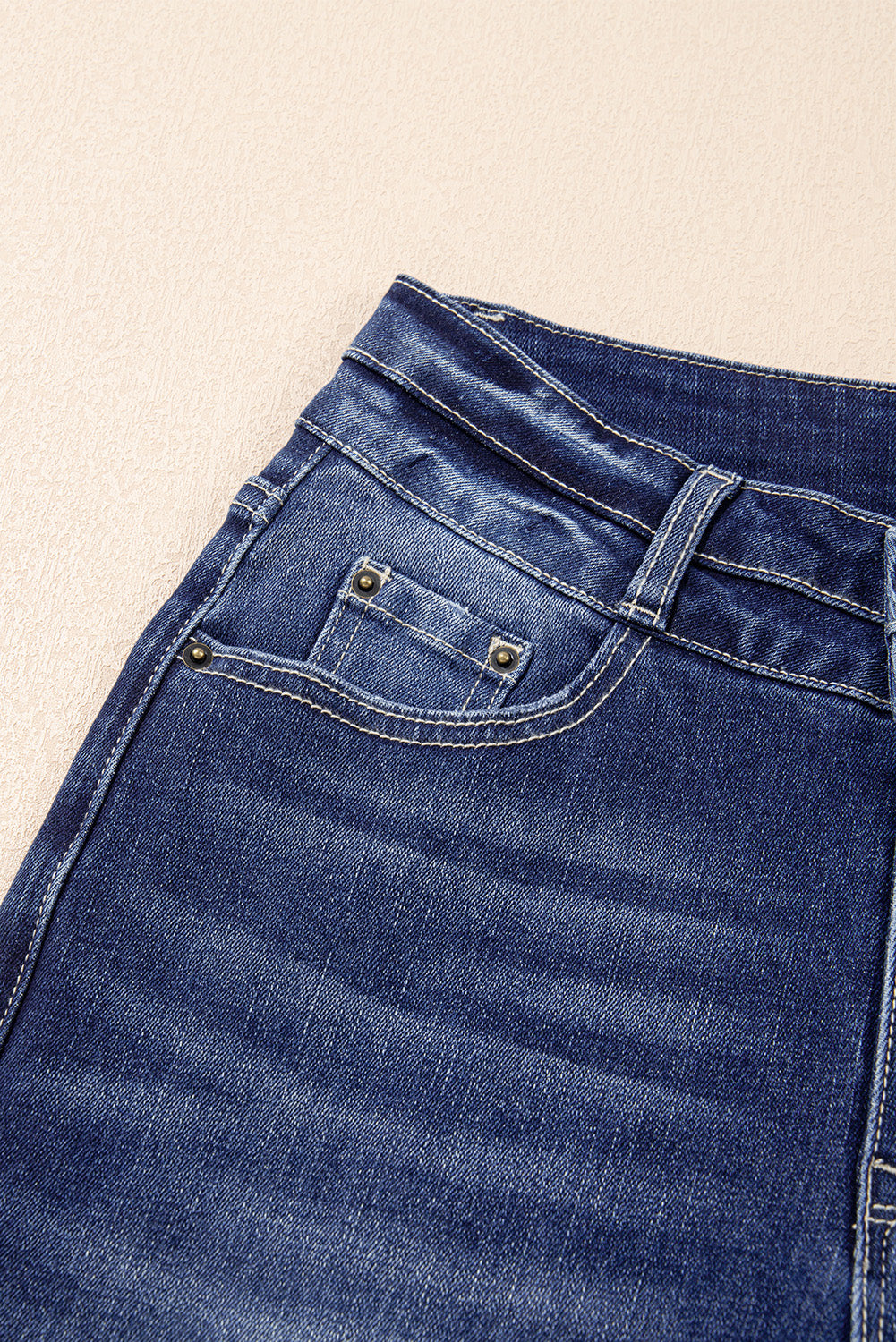 Sail blue high waist dual button distressed flared jeans with raw hem