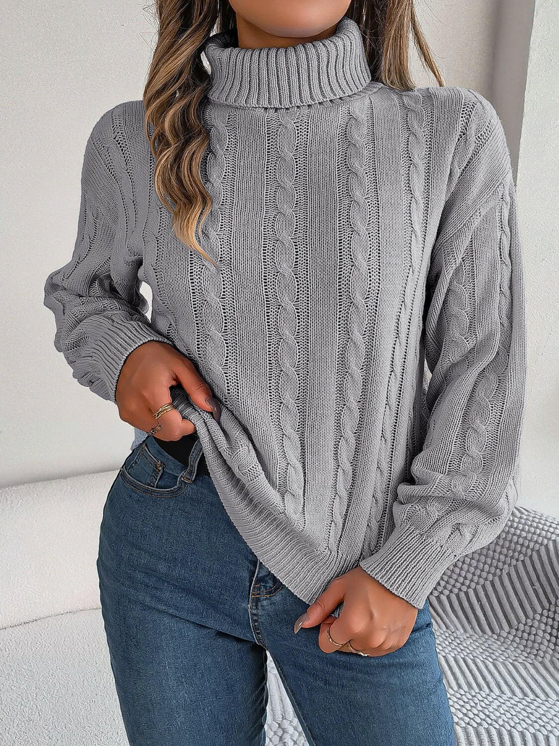 Cable-Knit Turtleneck Dropped Shoulder Sweater.