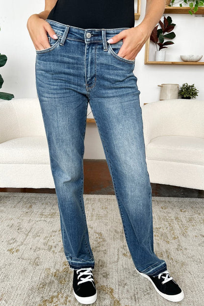 Trendy mid-rise release hem jeans by Judy Blue