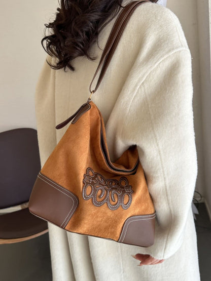 Chic suede patch tote with adjustable straps