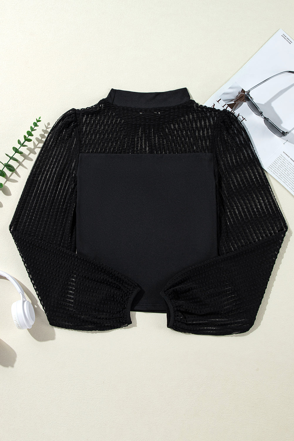 Sophisticated black mesh blouse with stand collar and lantern sleeves