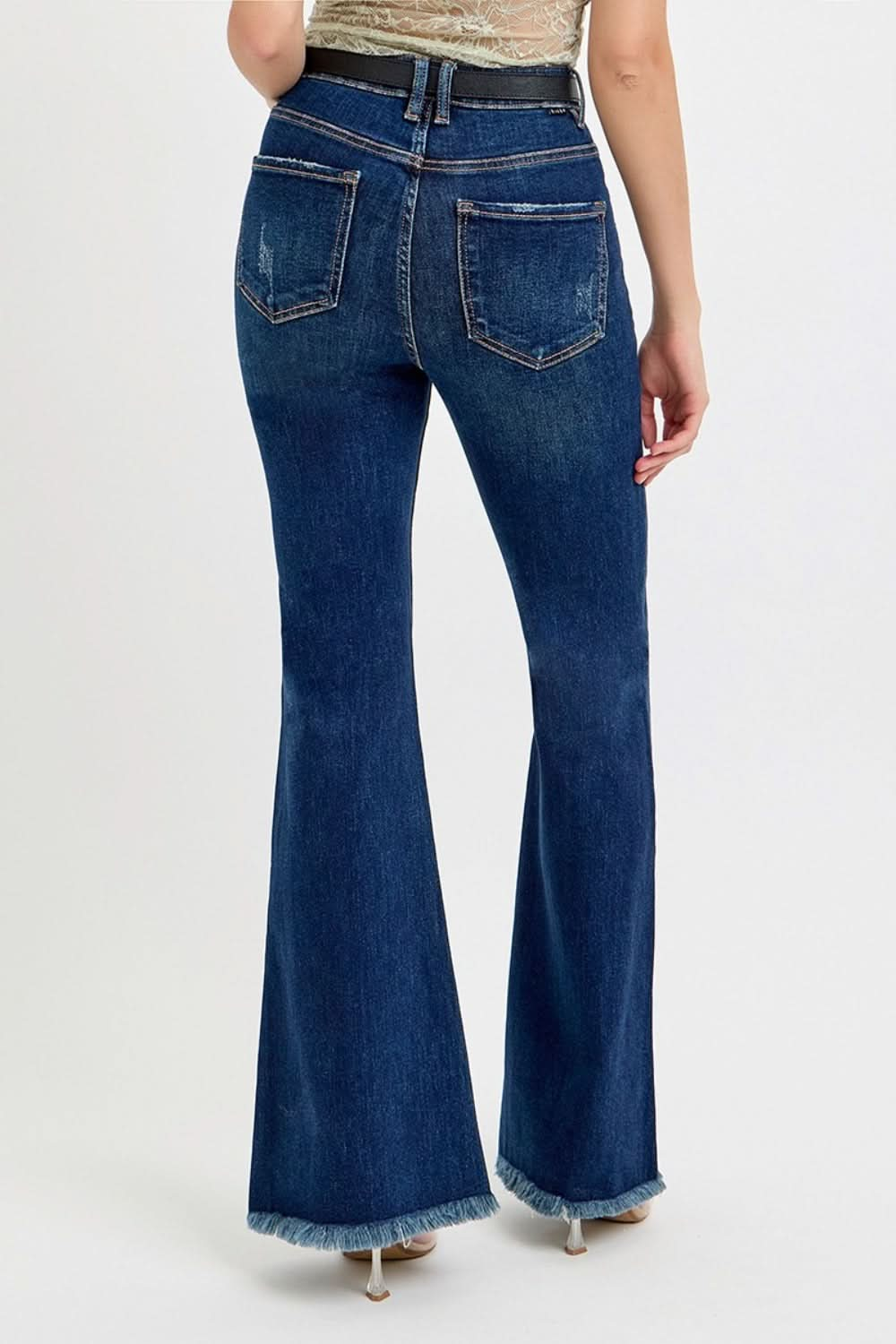 High-rise tummy control flare jeans with frayed hem and belt