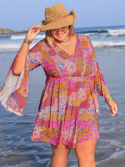 Plus Size Ruched Printed Long Sleeve Dress.