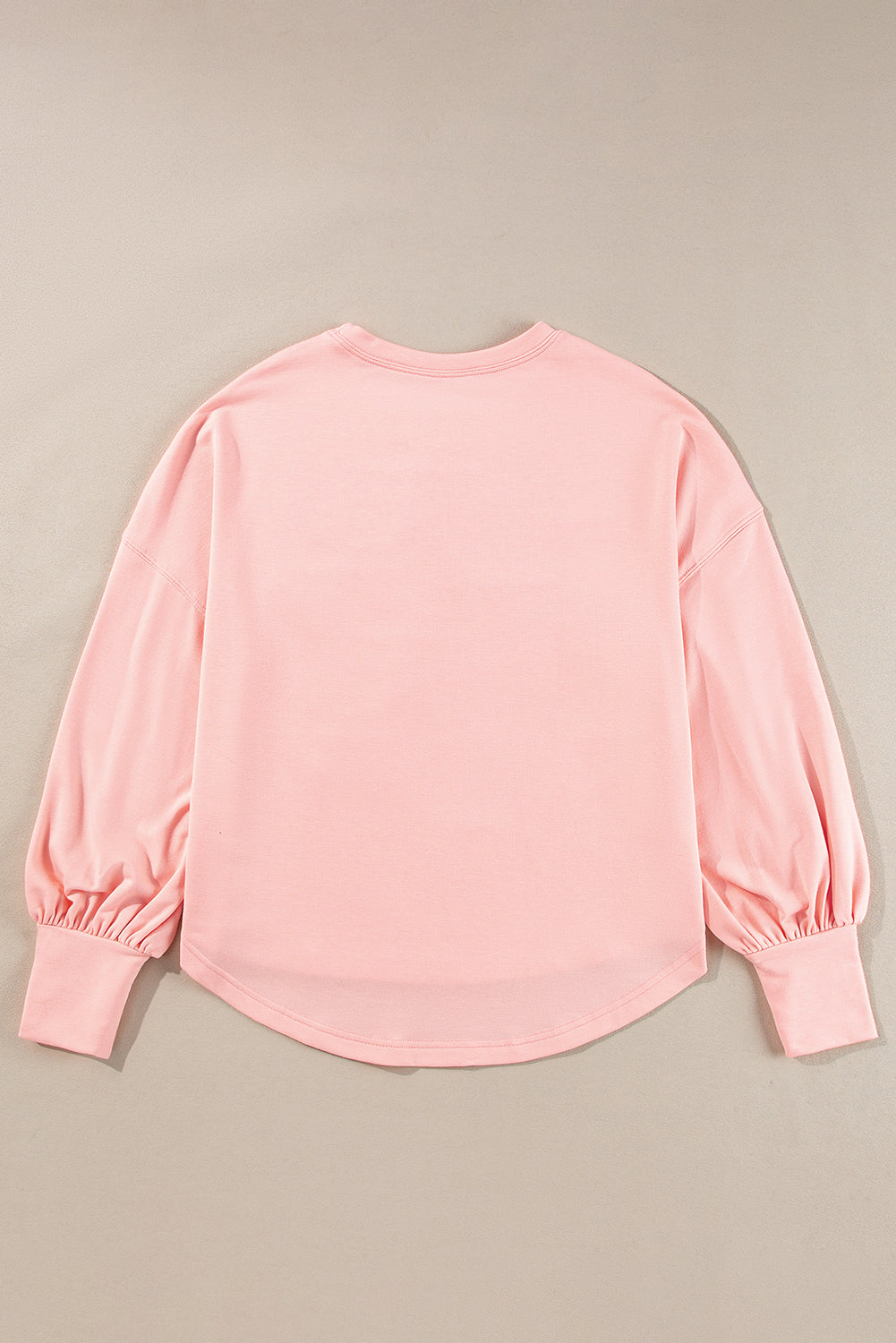 Celestial chic: Gossamer pink oversized long sleeve top with star graphic and studs