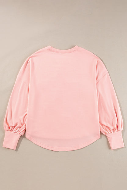 Celestial chic: Gossamer pink oversized long sleeve top with star graphic and studs