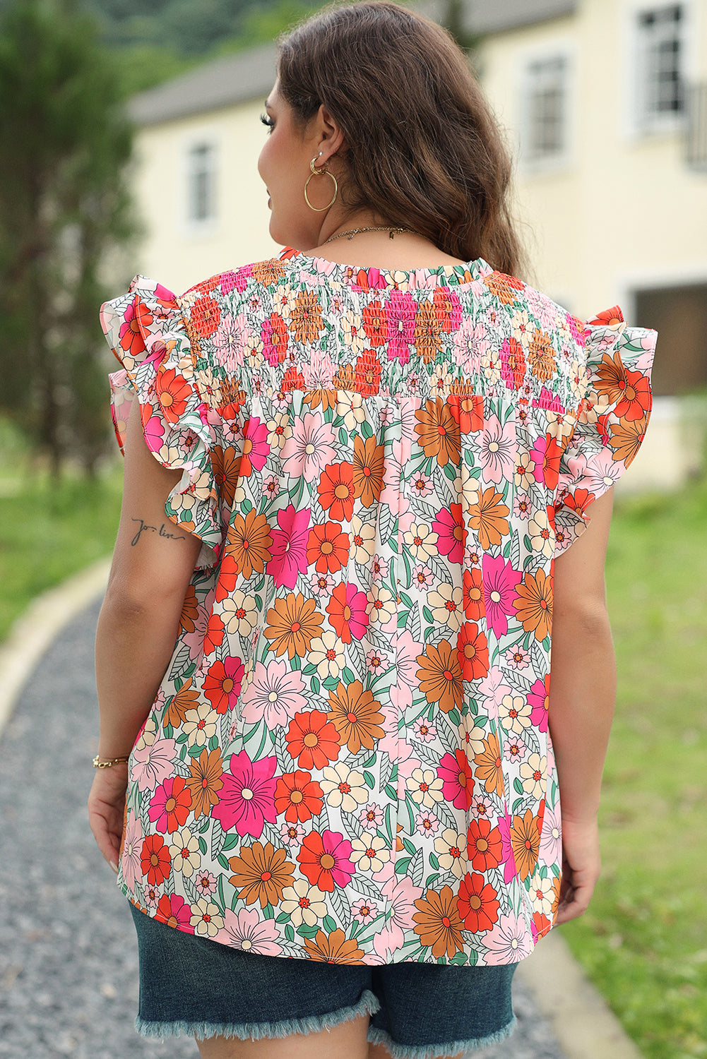 Vibrant floral plus-size ruffle sleeve blouse with notched neckline