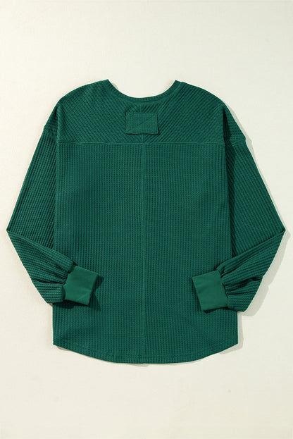 Chic blackish green waffle knit V-neck long sleeve blouse with drop shoulders