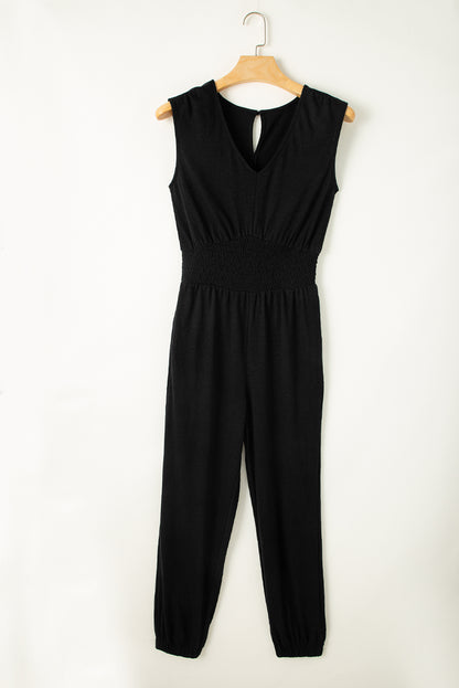 Sleek black sleeveless jumpsuit with v-neck and shirred design