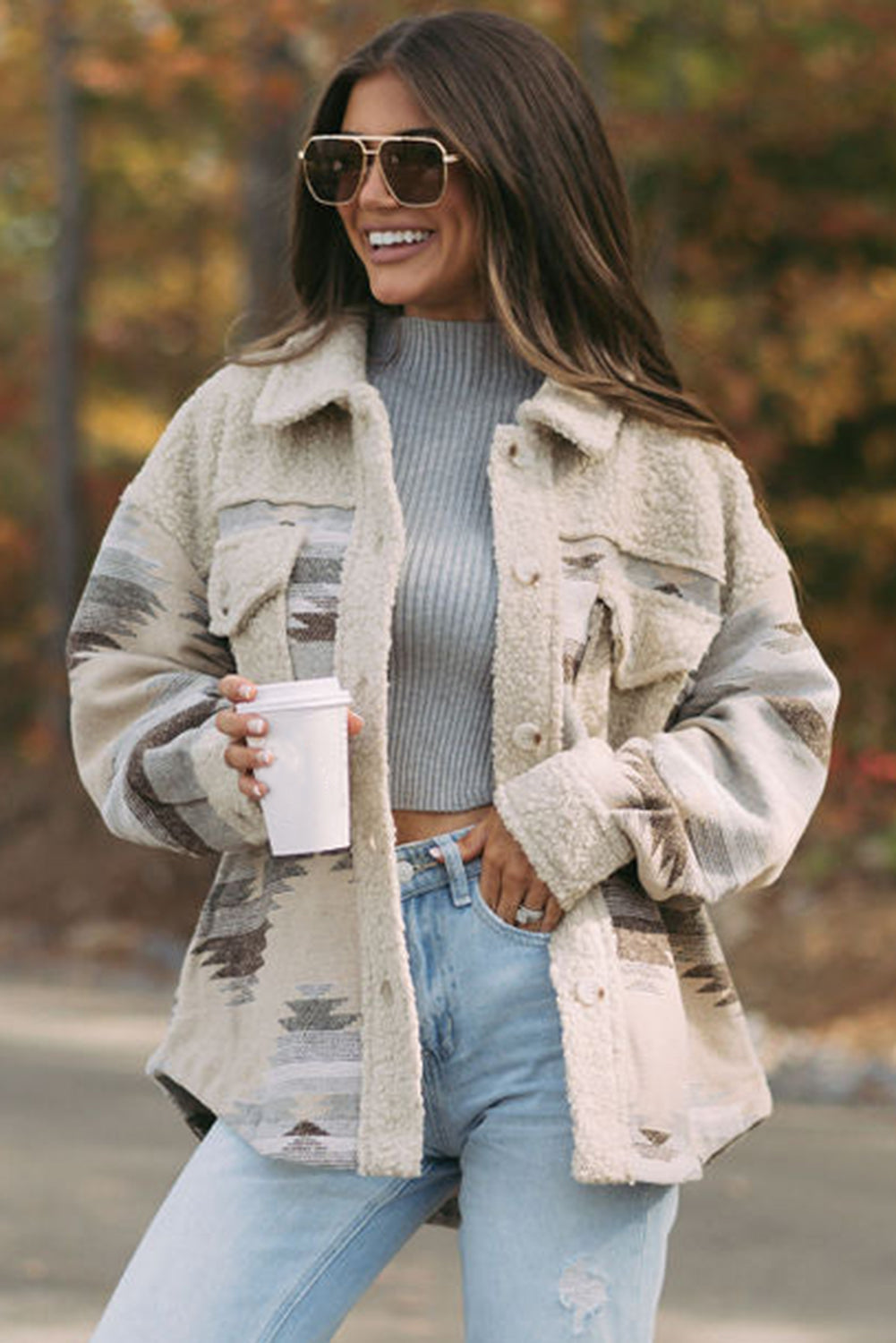 Khaki sherpa coat with vibrant Aztec print and flap pockets