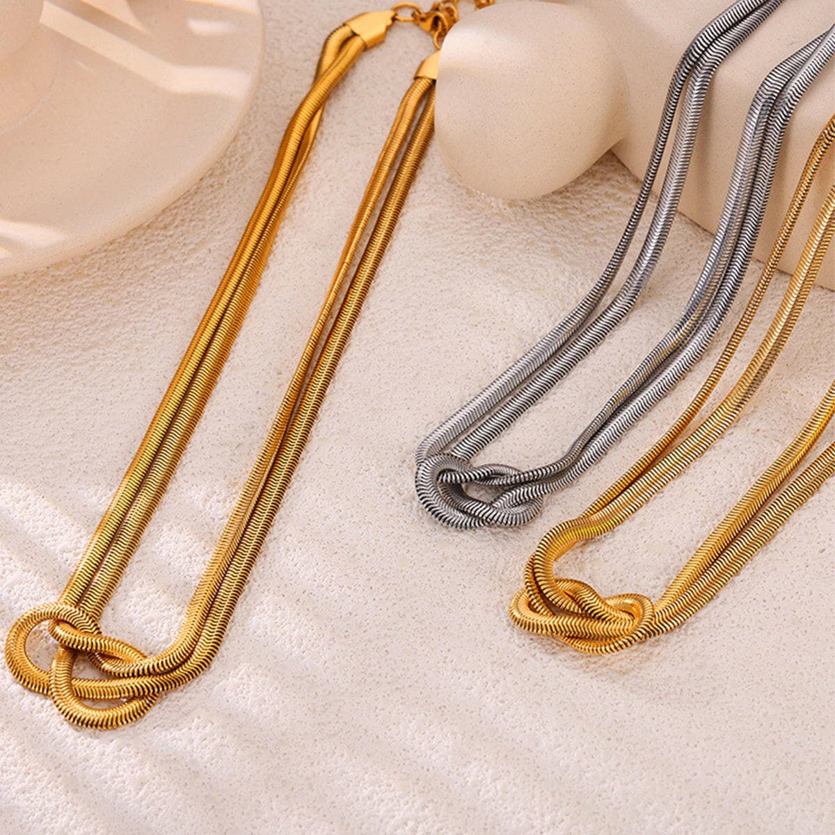 Elegant Titanium Steel Knot Pendant with Gold Plating.