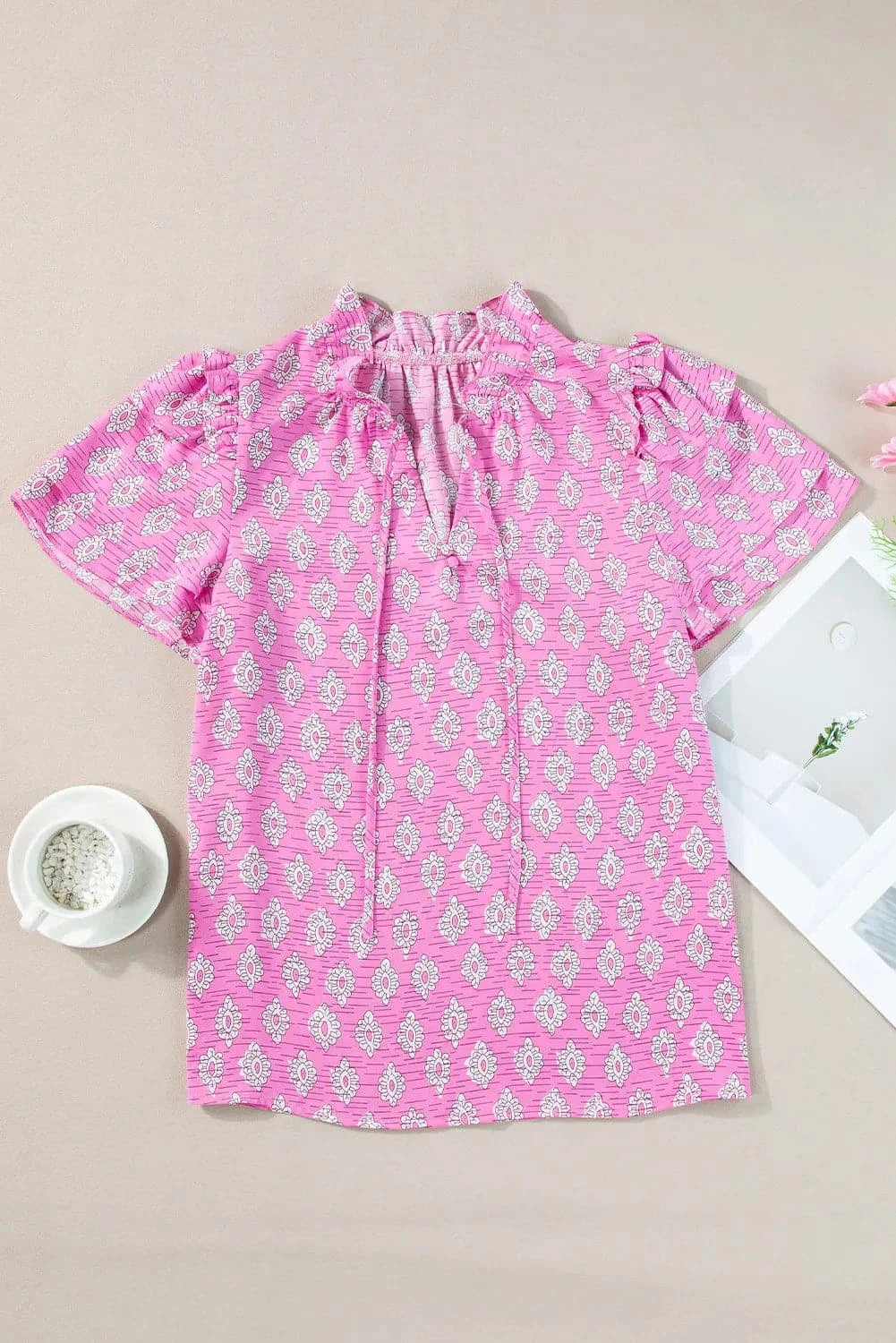 Ruffled Printed Tie Neck Short Sleeve Blouse.