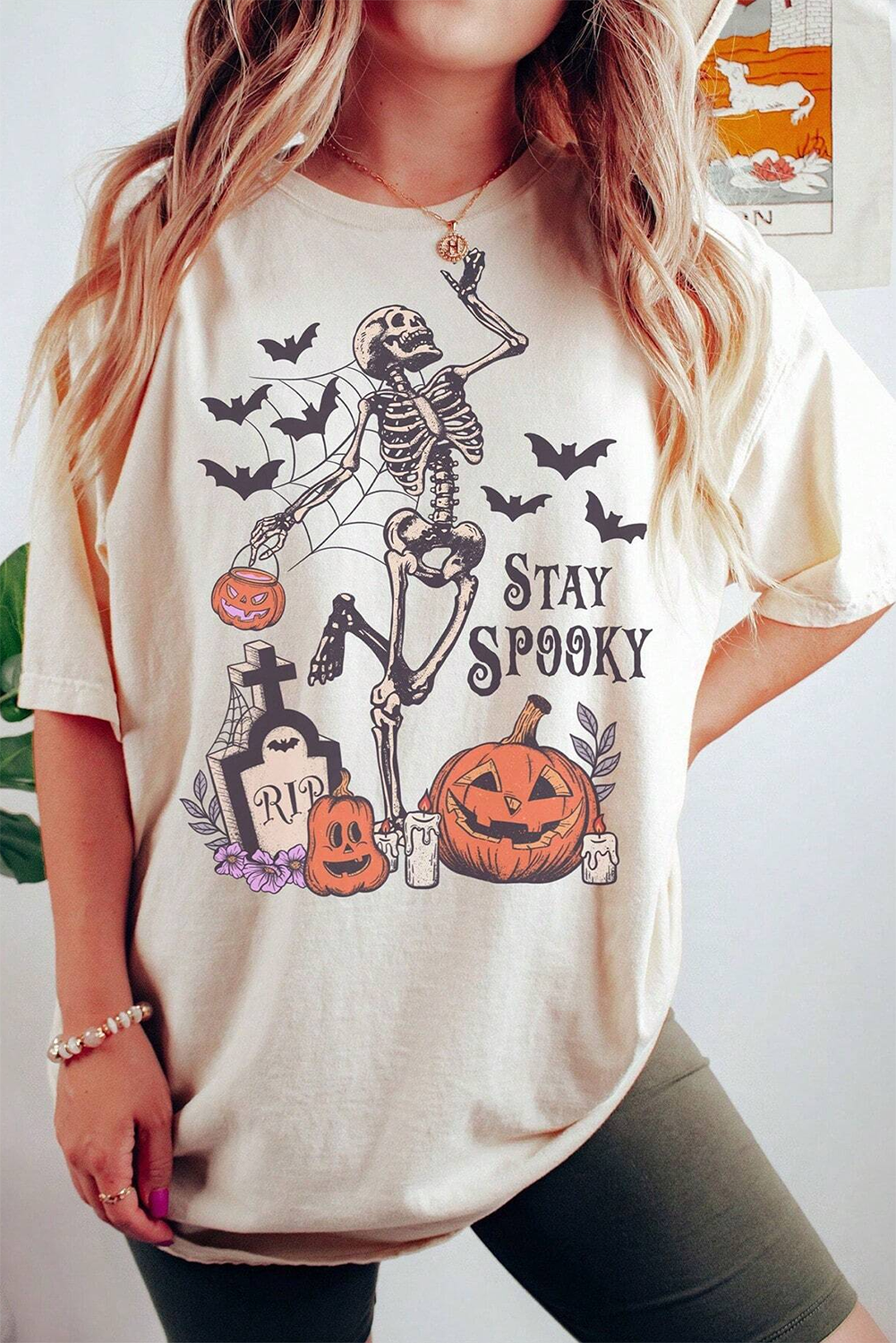 Stay spooky graphic tee featuring a skull pumpkin design for Halloween fun