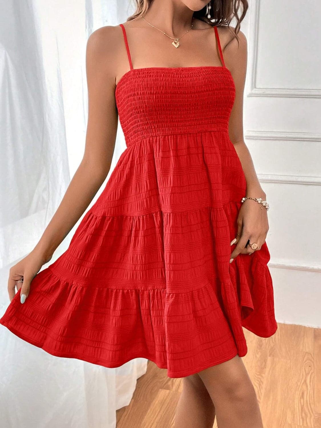 Smocked Tiered Sleeveless Mini Dress.