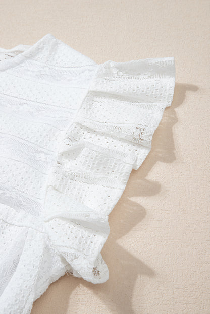 Lace-trimmed white flowy tank top with ruffled accents