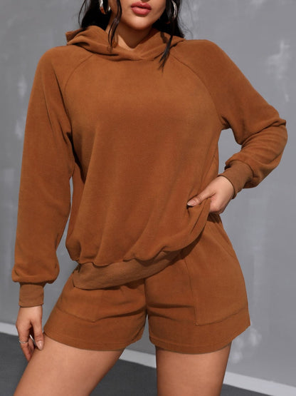 Cozy long sleeve hoodie and shorts ensemble with pockets