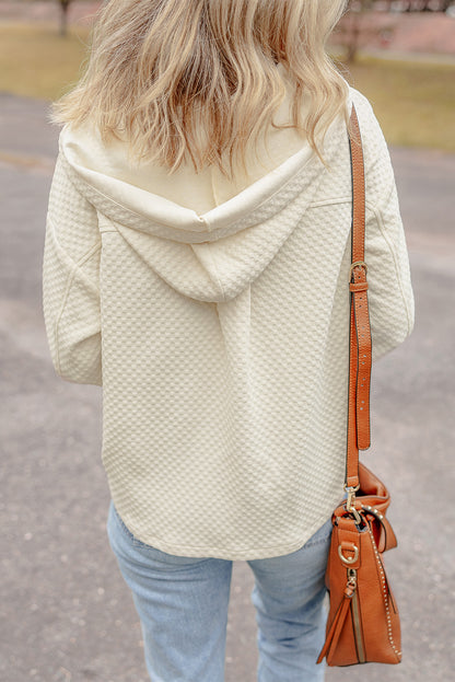 Chic apricot hoodie with buttoned neckline and functional pockets