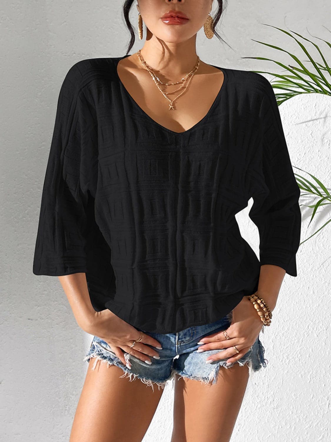 V-Neck Three-Quarter Sleeve Knit Top.