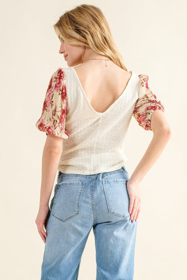 Floral elegance: Textured sleeve knit top for effortless style