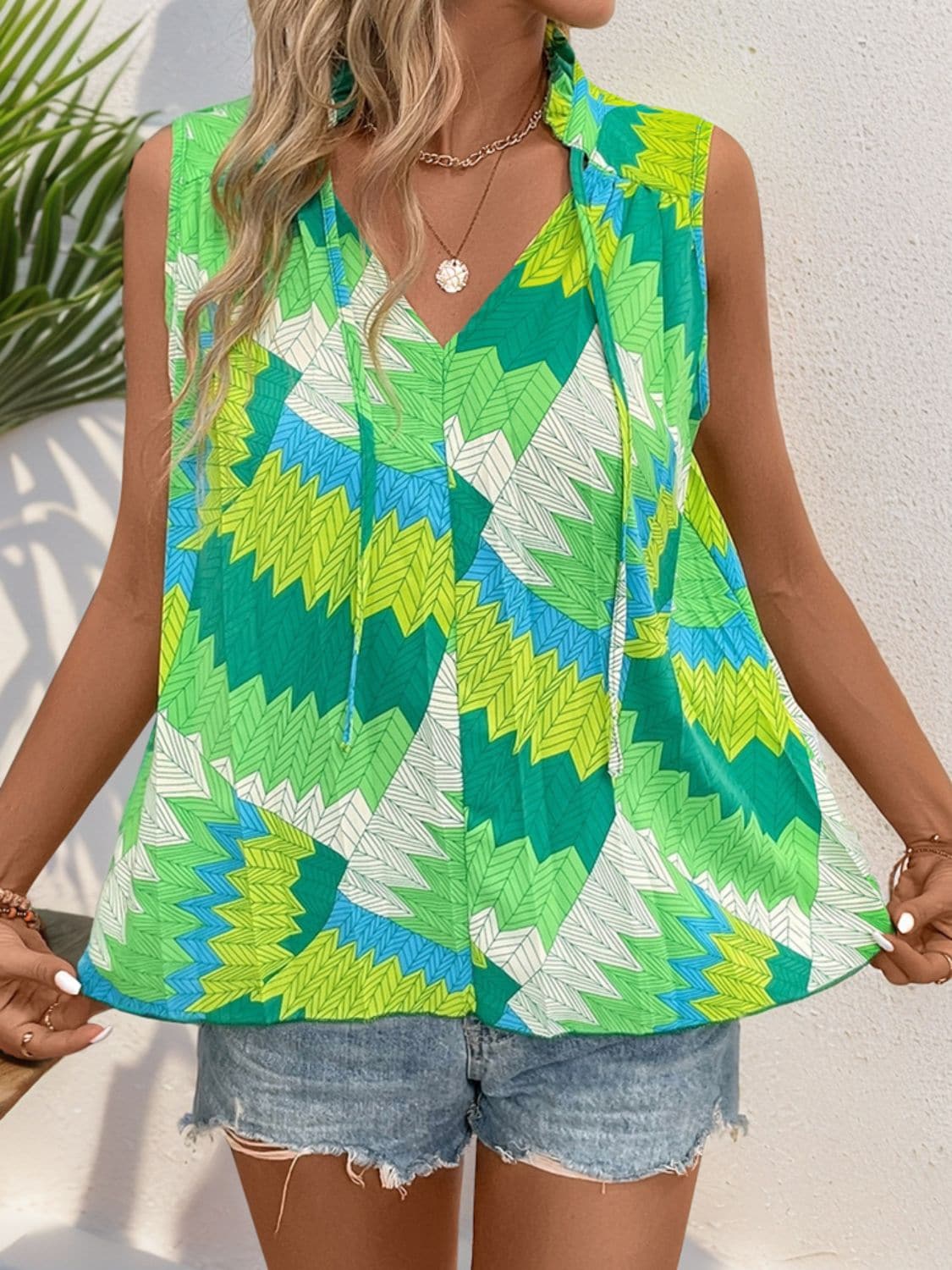 Printed Tie Neck Sleeveless Top.