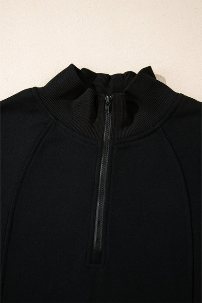 Chic black zip-neck sweatshirt with drop shoulder design