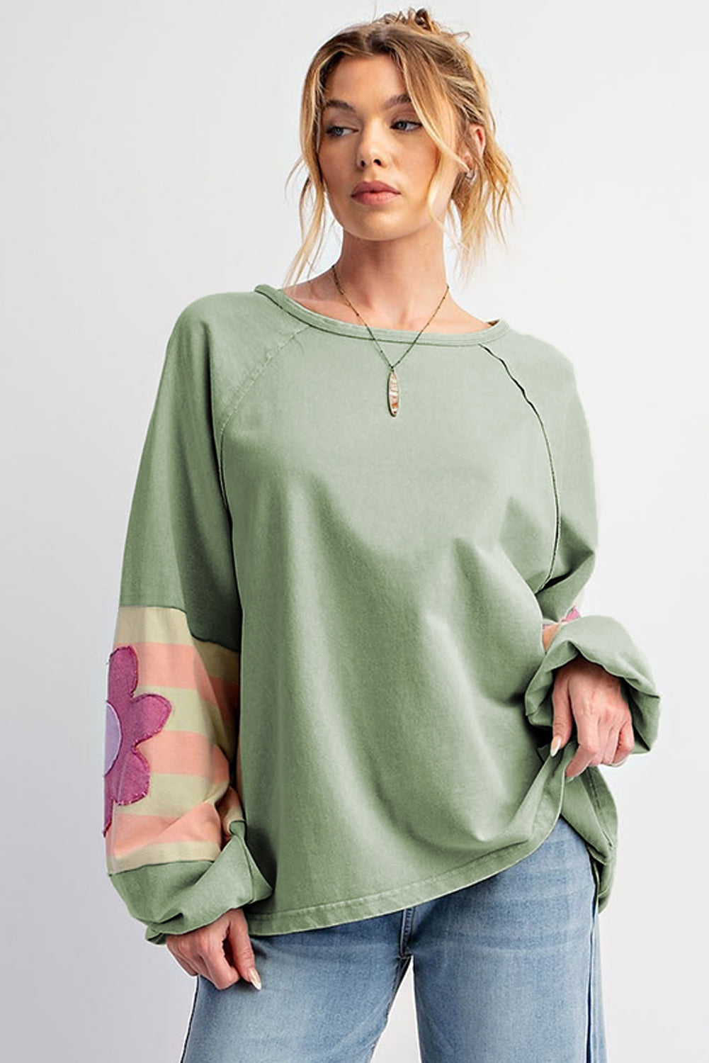 Floral patchwork oversized top with exposed seams in smoke green