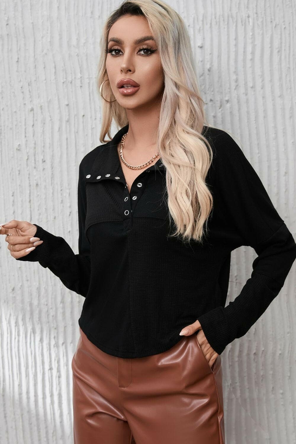 Ribbed Knit Henry Collar Loose Fitting Long Sleeve Top.