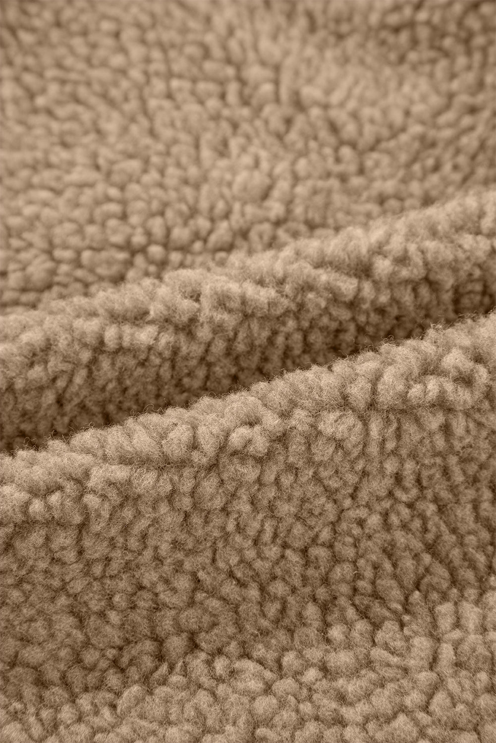 Detailed texture of the Love Salve Cozy Fleece Jacket, showing the quality fabric and durable hem for lasting wear.