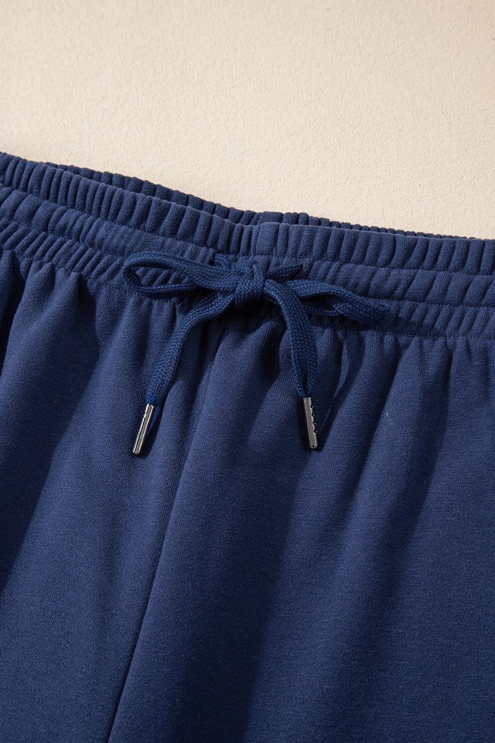 Navy blue fleece joggers with drawstring