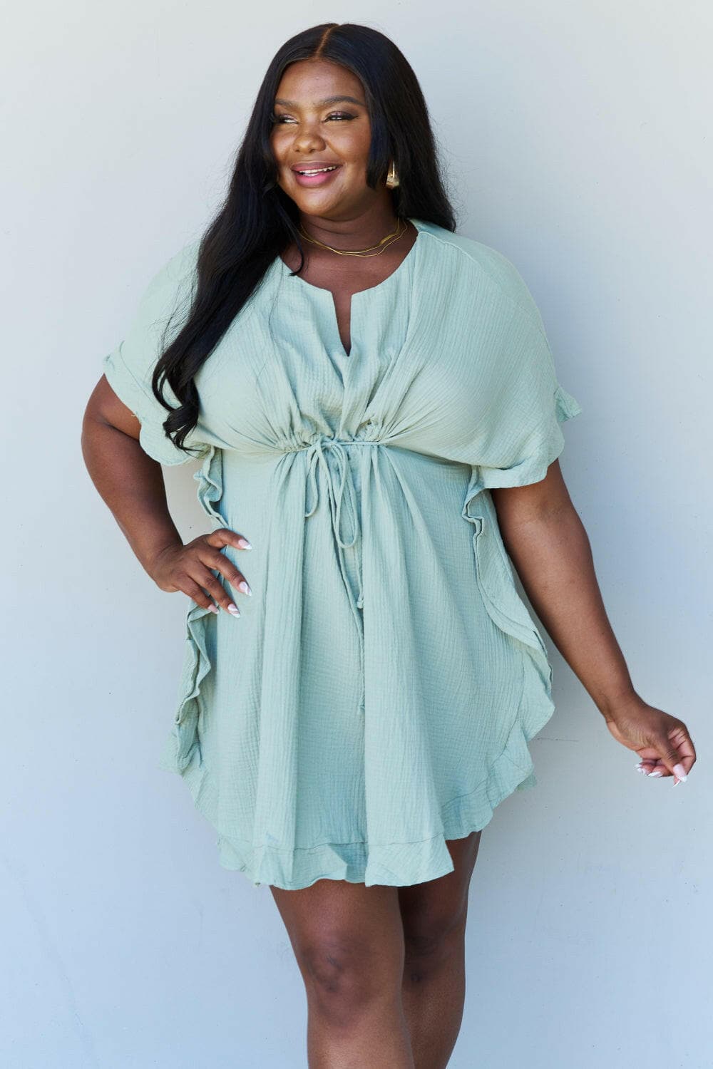 Ninexis Out Of Time Full Size Ruffle Hem Dress with Drawstring WaistbaExperience Effortless Elegance with the Ninexis Out Of Time Full Size Ruffle Hem Dress in Light Sage. This stunning dress is crafted from 100% cotton, providing a soLove Salve Time Full Size Ruffle Hem DressTIKTOK