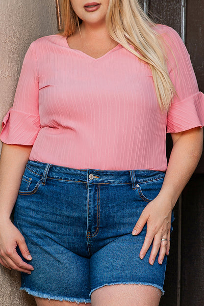 Peach blossom textured plus top with ruffled sleeves and V-neck