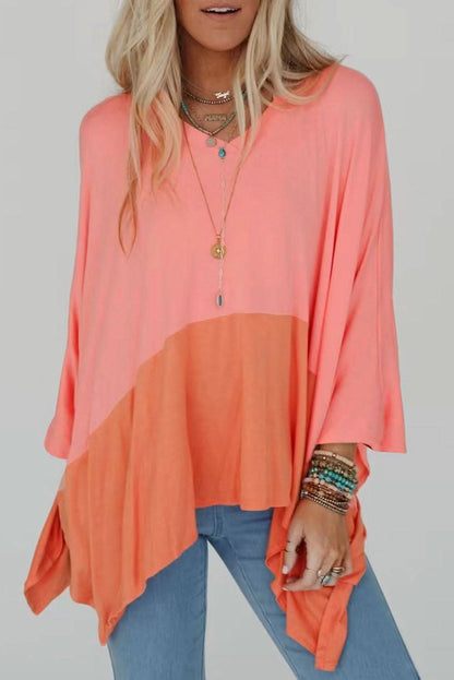 Grapefruit orange contrast color patchwork oversized top with side split and V-neck design.