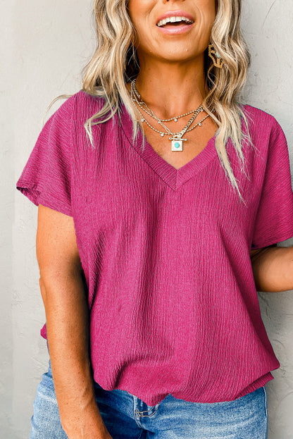 Vibrant pink textured bubble hem top for plus sizes