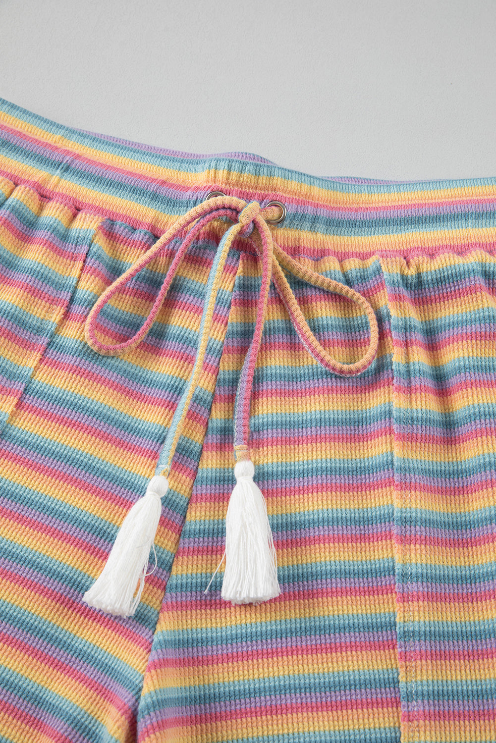 Chic pink striped tee and tassel shorts set for summer lounging