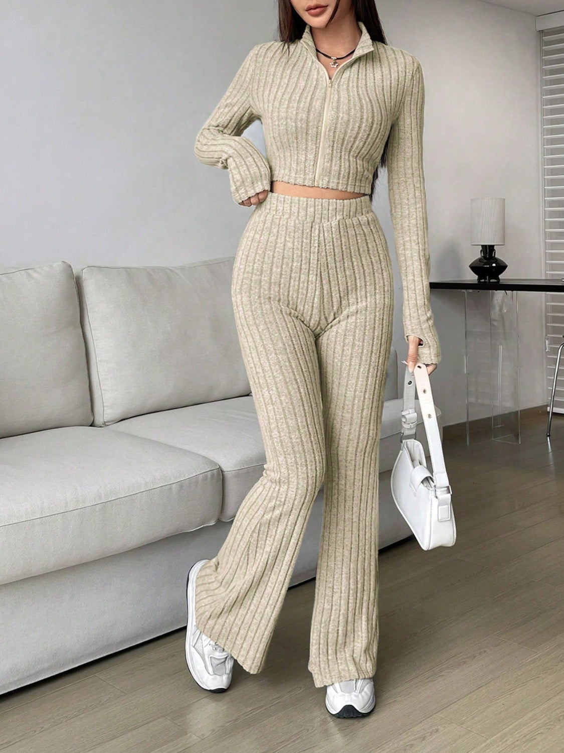 Zip Up Long Sleeve Top and Pants SetFeatures: Basic style
Number of pieces: Two-piece
Stretch: Slightly stretchy
Material composition: 95% polyester, 5% elastane
Care instructions: Machine wash cold. TLove Salve Long Sleeve TopTwo-Piece Sets