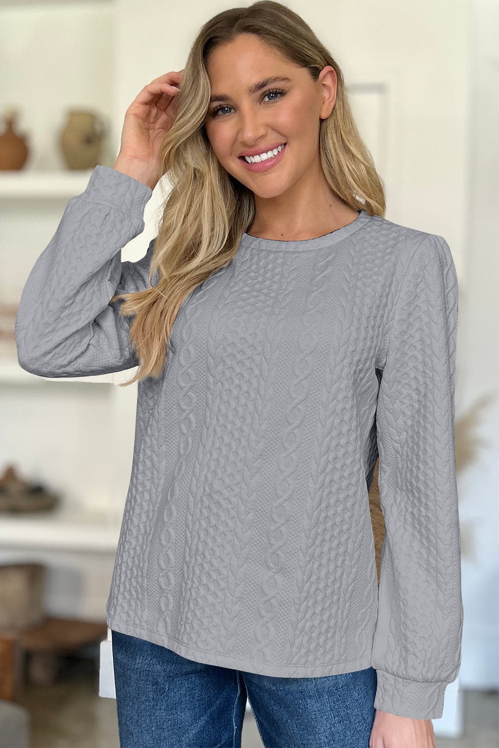 Textured Round Neck Long Sleeve Sweatshirt.