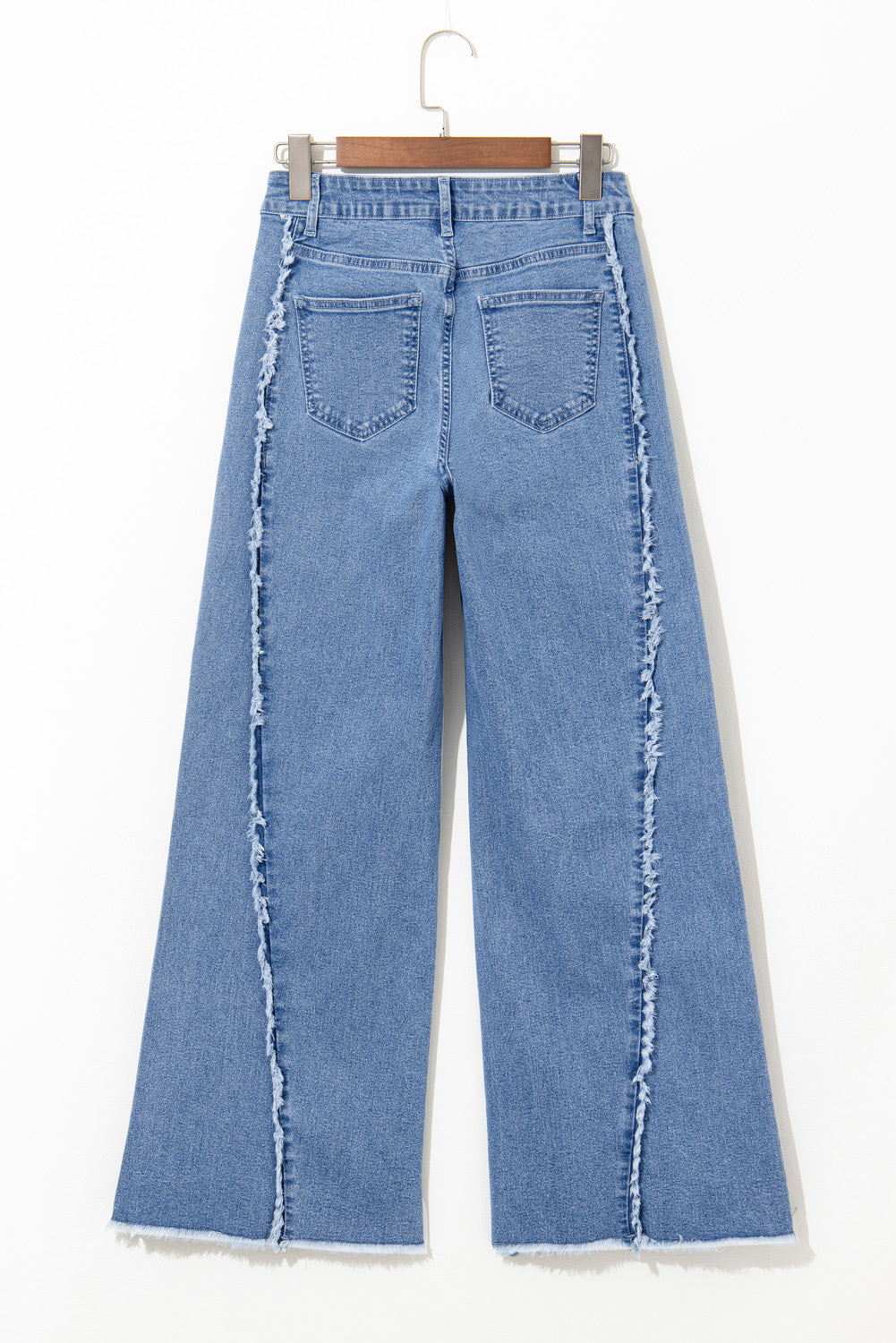 Vintage-inspired Beau Blue flared jeans with raw hem detailing