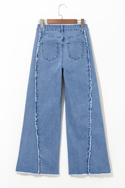 Vintage-inspired Beau Blue flared jeans with raw hem detailing