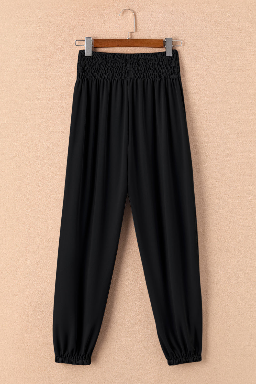 Chic black smocked high-rise joggers for a trendy look