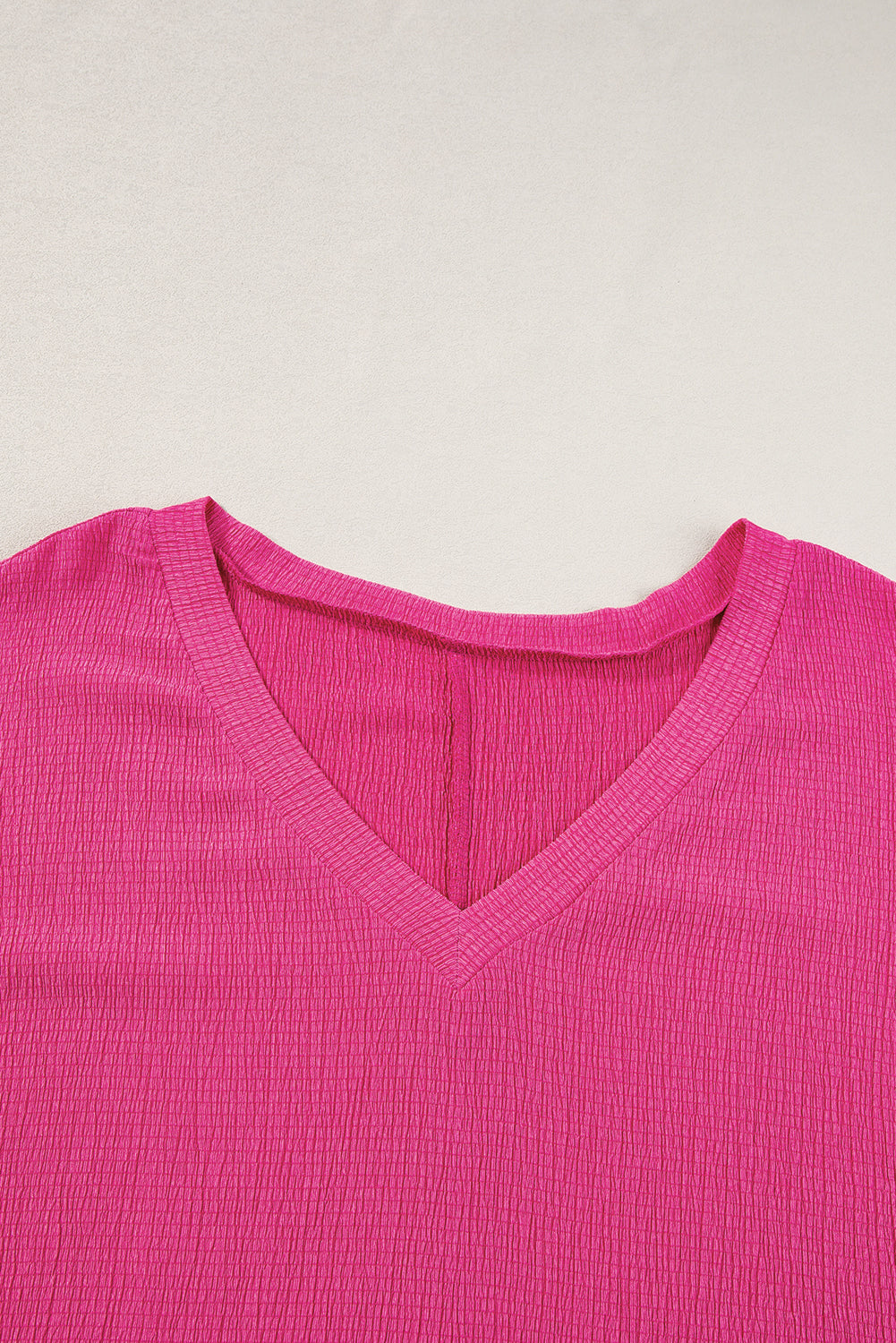 Vibrant pink textured bubble hem top for plus sizes