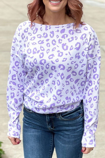 Cozy purple leopard print top with boat neck and drop shoulders