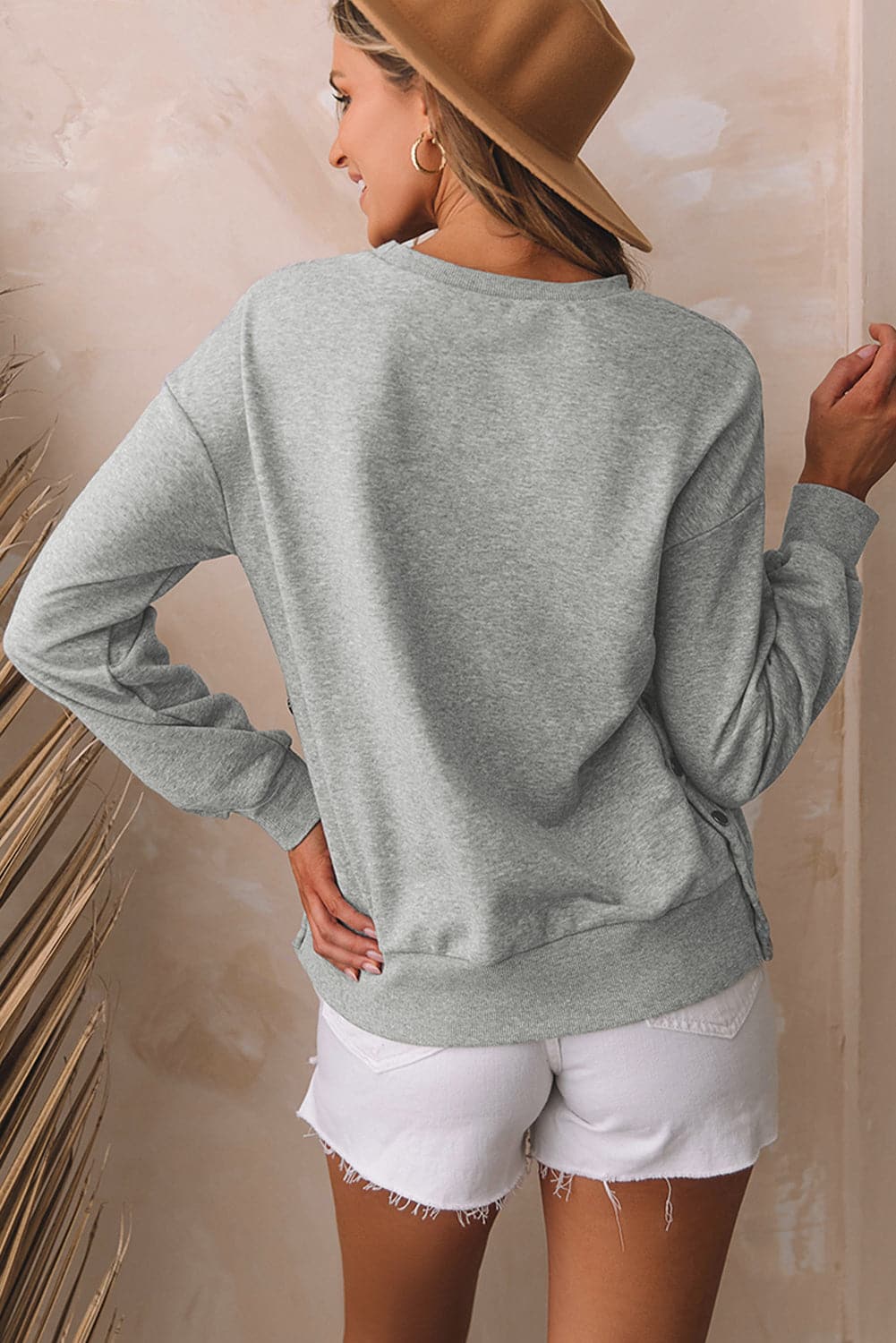 Round Neck Dropped Shoulder Sweatshirt.