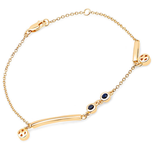 Bids.com 18K Yellow Gold Plated .925 Sterling Silver Bracelet featuring genuine blue sapphire gemstones, elegantly displayed.