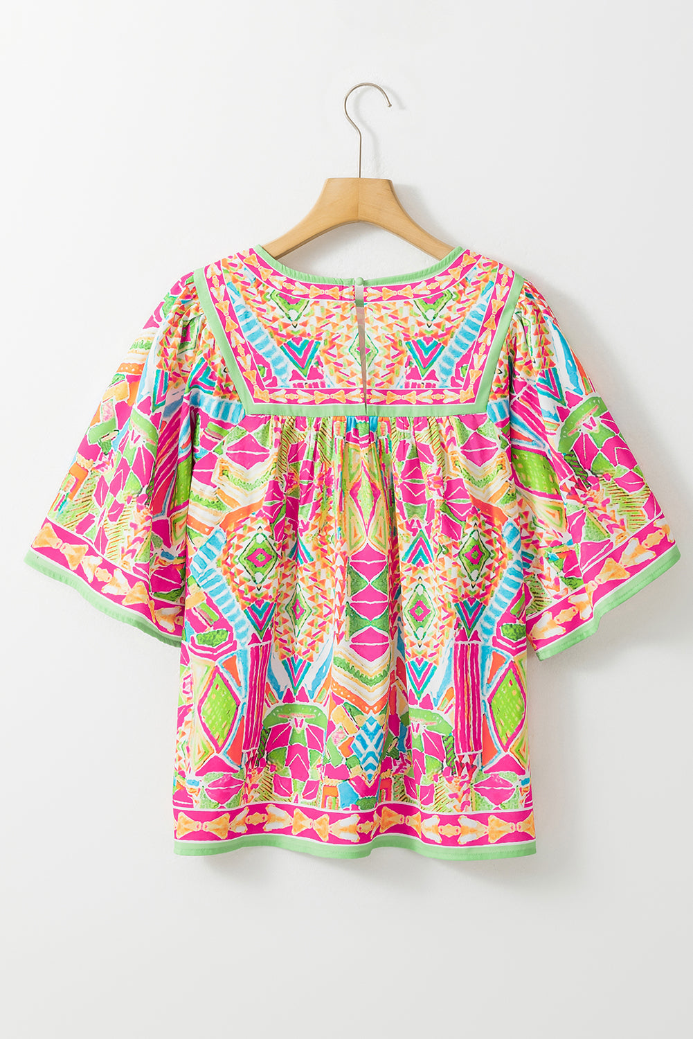 Chic orange geometric print babydoll blouse with bell sleeves