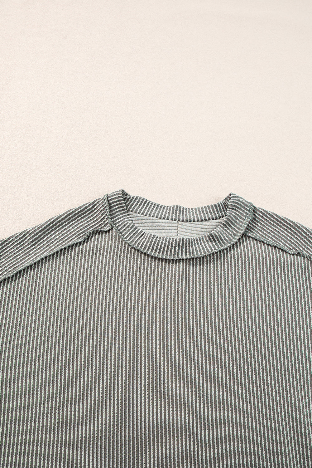 Chic medium grey textured knit t-shirt with exposed stitching