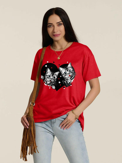 Chic cat print drop shoulder tee in red with oversized design, worn by model.