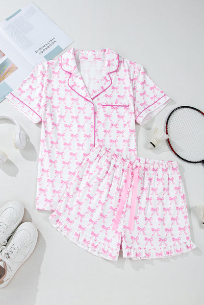 Pink bowknot printed short sleeve pajama set with ruffled shorts.