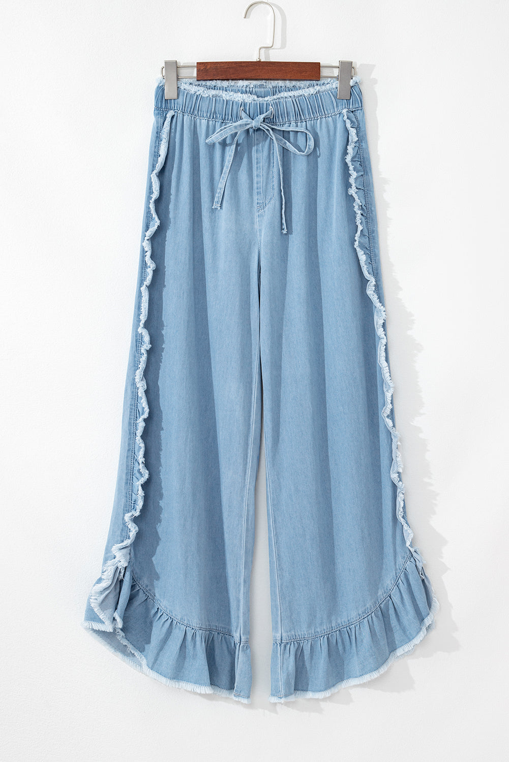 Myosotis light wash ruffled wide leg jeans with raw hem detail