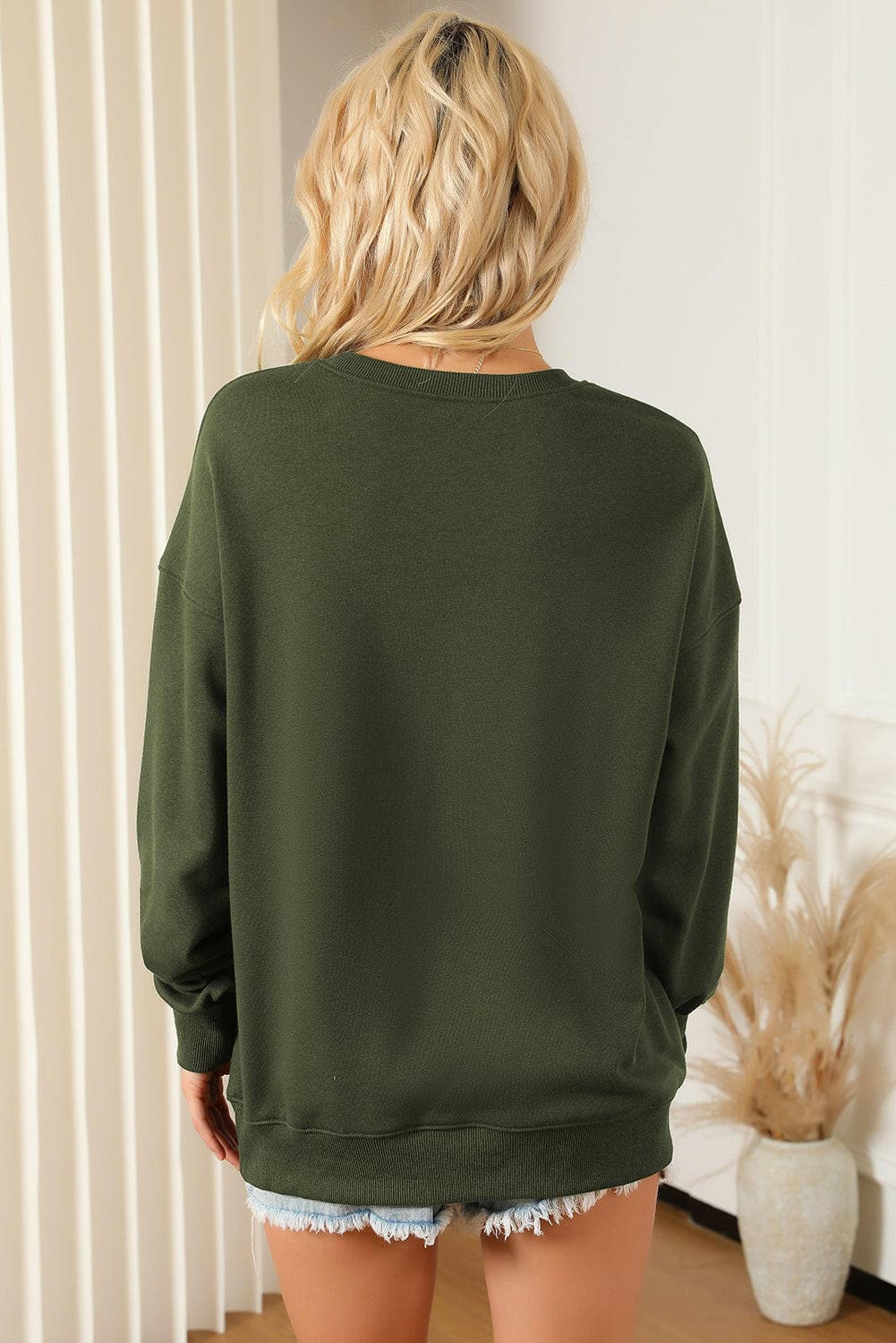 Pocketed Round Neck Dropped Shoulder Sweatshirt.